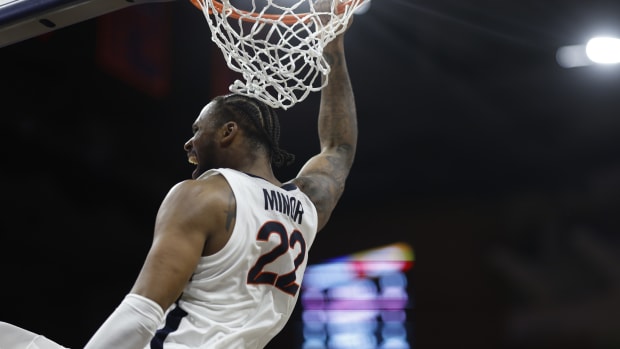 Virginia Cavaliers forward Jordan Minor (22) dunks the ball against the Virginia Tech Hokies in the second half at John Paul Jones Arena.